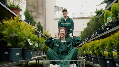 Greenery-and-Laughter:-Joyful-Employees-Transporting-Plants-in-Specialized-Store