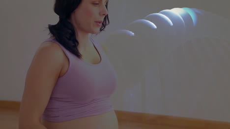 pregnant woman practicing prenatal exercise indoors, displaying glowing molecular dna model overlay
