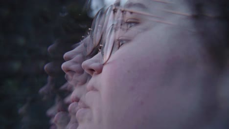 adult female wearing glasses captured in mirror and kaleidoscope effect