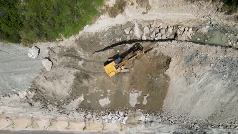 construction excavator clearing way for new road