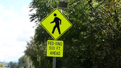 pedestrian crossing sign with flashing lights