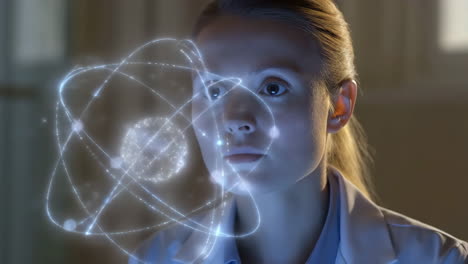 woman scientist studying atom model