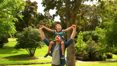 Father-giving-a-piggy-back-to-his-son