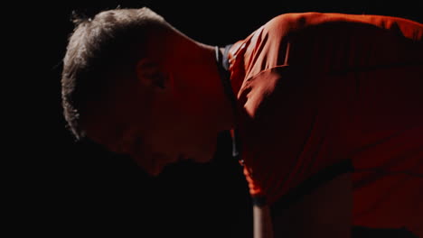 man exercising in low light