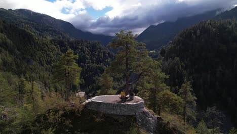 young hiker relaxing and enjoying the view on lookout point in switzerland