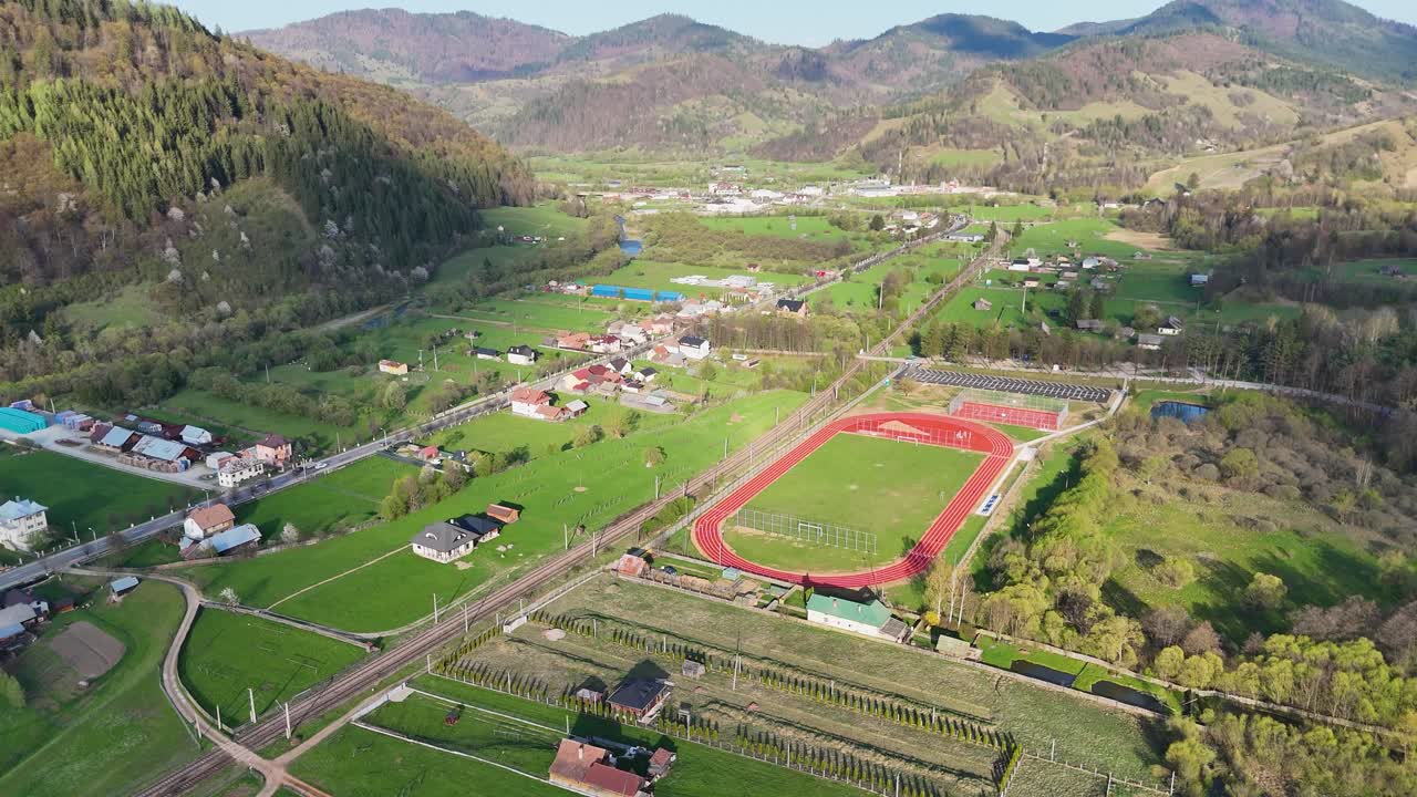 Drone view of stadium near Campulung city at sunset