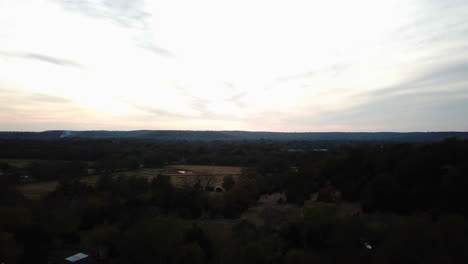 Aerial-establishing-shot-of-a-small-pond-in-the-remote-countryside-of-Georgia