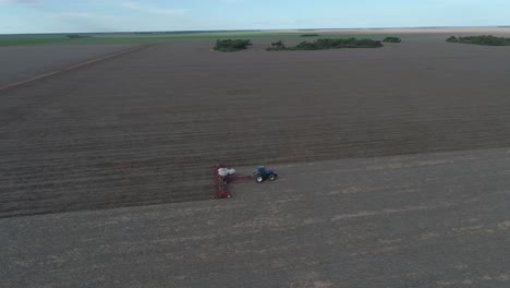 harvesters lifting corn from the field, aerial view