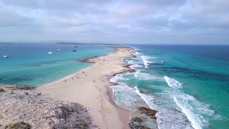 large waves break on headland