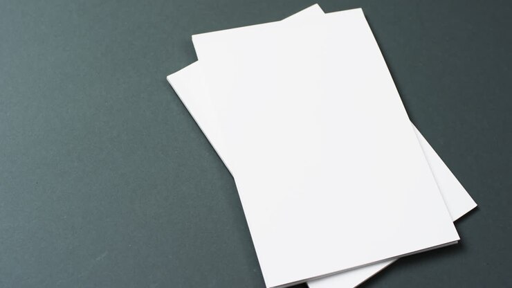 Video of books with white blank pages and copy space on black background