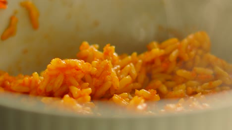 delicious hot spicy rice steaming after cooking in bowl. slow motion food footage