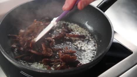 cooking mushrooms in a pan