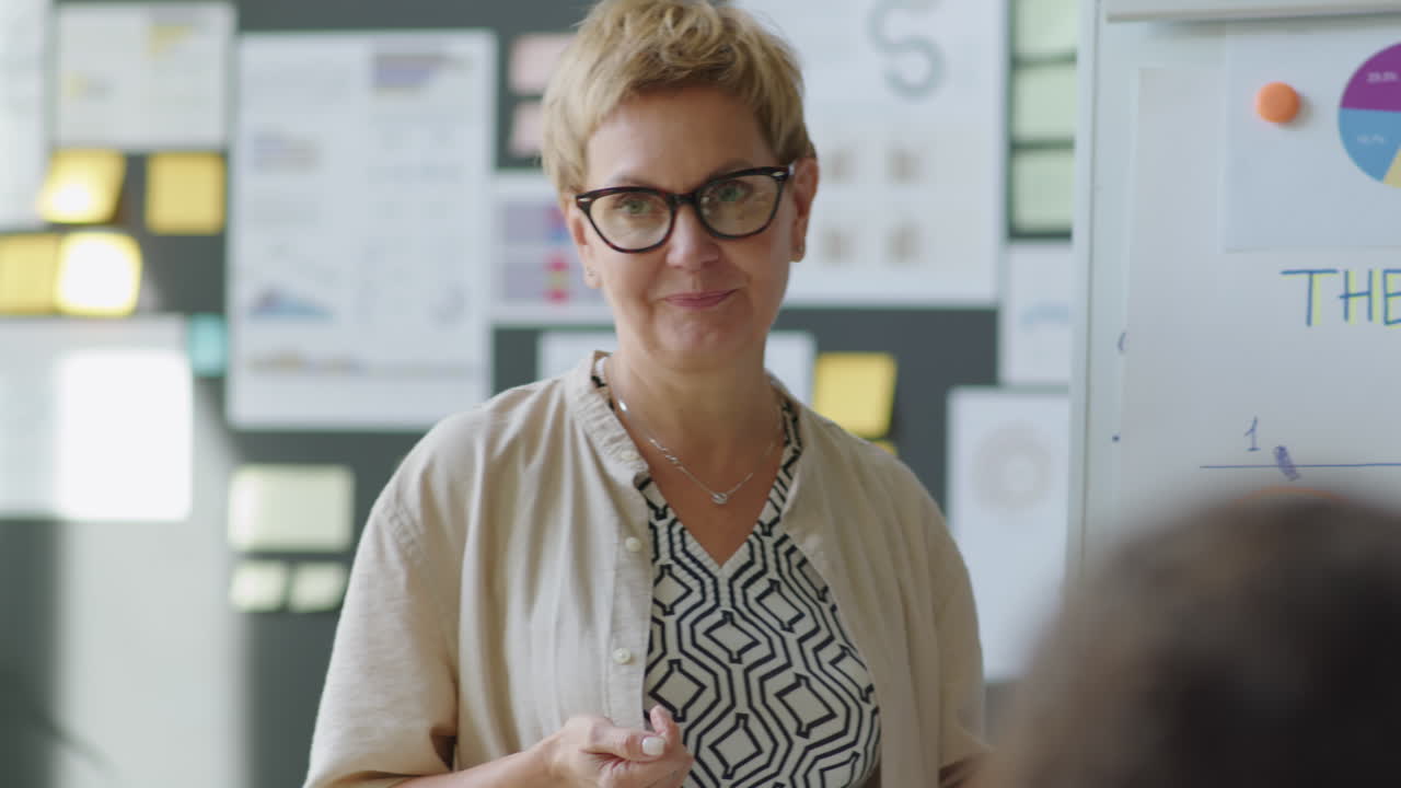 Female Corporate Trainer Giving Presentation