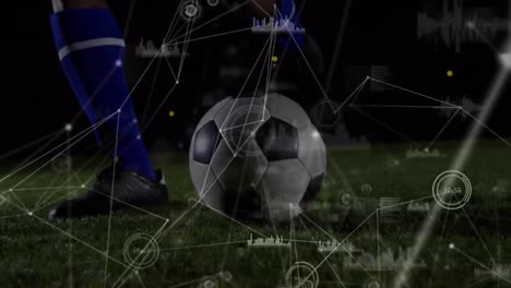 Animation-of-network-of-connections-over-african-american-male-soccer-player-kicking-the-ball