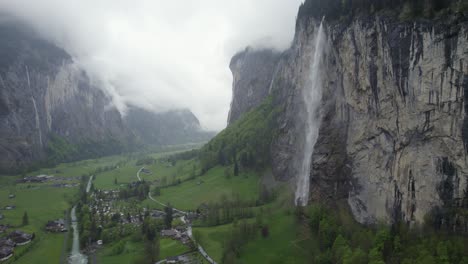 Staubbach-Waterfall-on-Lauterbrunnen-Mountain-Cliff,-Switzerland-Landscape---Aerial-Drone-Panorama