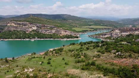 Congost-de-Mont-Rebei-Canyon-at-Ager,-Catalonia-and-Aragon,-Spain---Aerial-Drone-View-of-the-Blue-Emerald-Noguera-Ribagorçana-River-and-Beautiful-Green-Valley