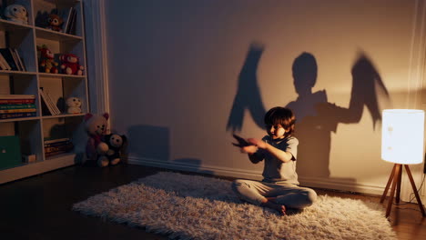 child playing shadow puppets in a cozy bedroom