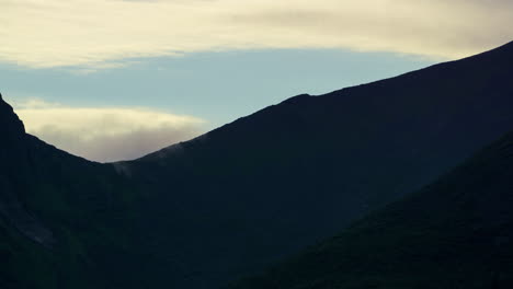timelapse of clouds rolling over a mountainside in lofoten islands