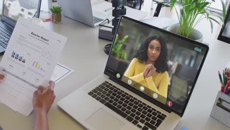 African-american-businesswoman-using-laptop-for-video-call-with-biracial-business-colleague