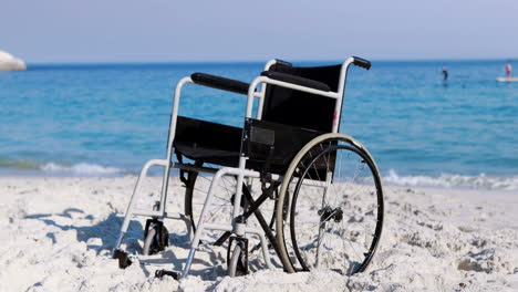 black wheelchair on the beach