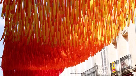 vibrant ribbons hanging in libourne, france