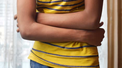 child holding stomach in pain