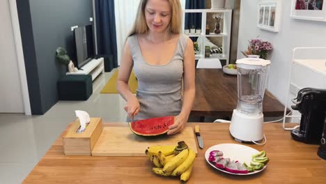 woman preparing a fruit smoothie