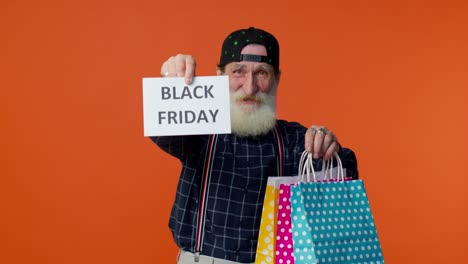 Älterer-Bärtiger-Mann-Mit-Bannertext-Zur-Aufschrift-„Black-Friday“,-Werberabatten-Und-Niedrigen-Preisen