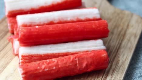 crab sticks on a wooden board