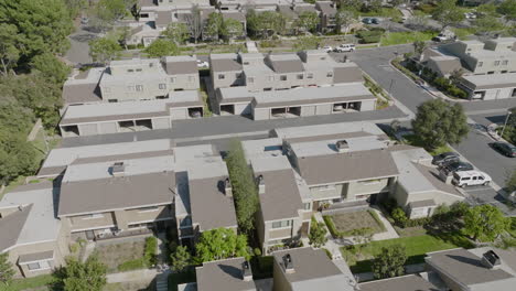 aerial flyover of condominiums in costa mesa, california during the day