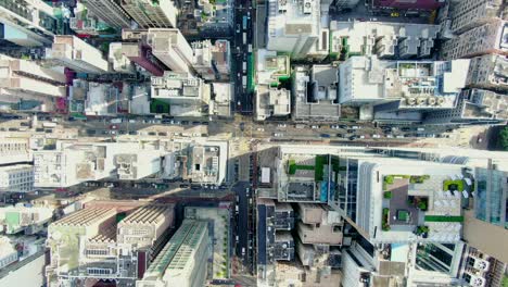 central hong kong, top down aerial view of traffic and city skyscrapers