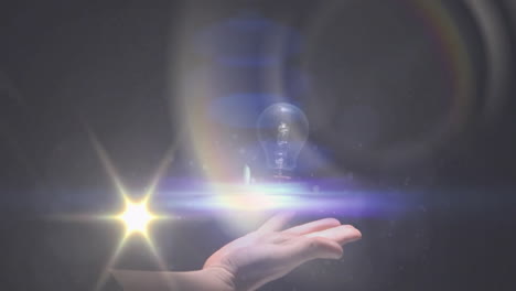 hand holding glowing light bulb, innovation and creativity animation