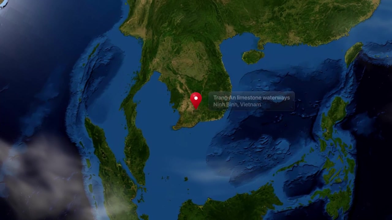 Earth rotates and zooms into Southeast Asia, marking Trang An limestone waterways in Vietnam. Includes NASA public domain imagery.