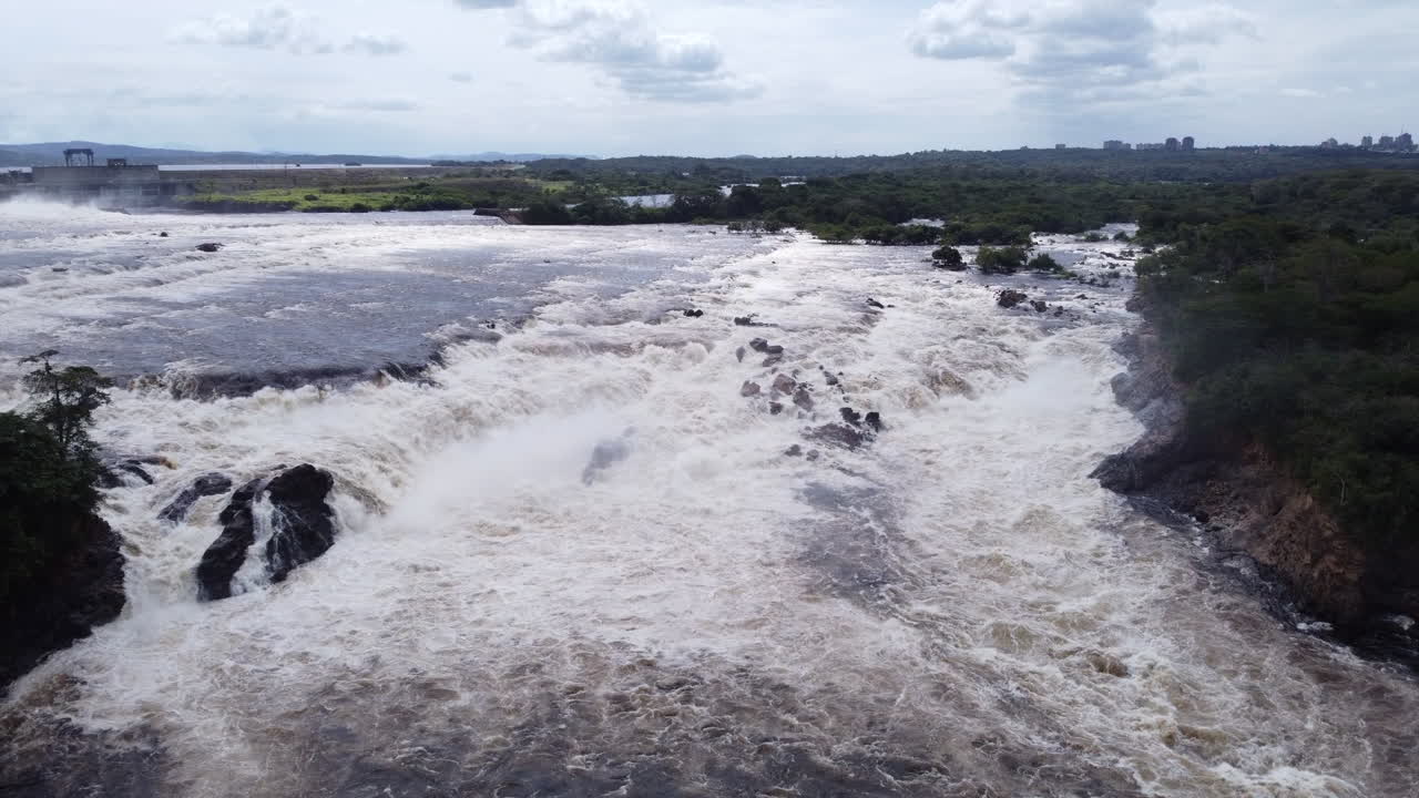 Powerful River Rapids and Hydroelectric Dam Landscape