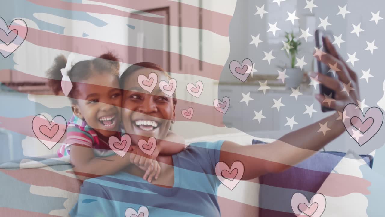 animación de la bandera de ee.uu. y corazones sobre mujer afroamericana y su hija tomando selfies