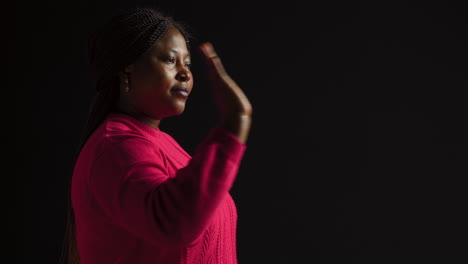 Woman-Firmly-Signals-Stop-With-Hand