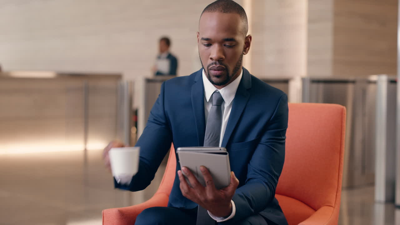 African American Businessman working in business lobby