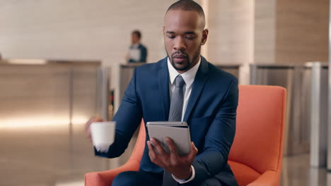 african american businessman working in business lobby