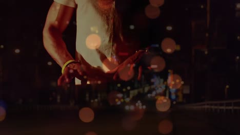 animation on blurred night road traffic over caucasian man playing keyboard on concert