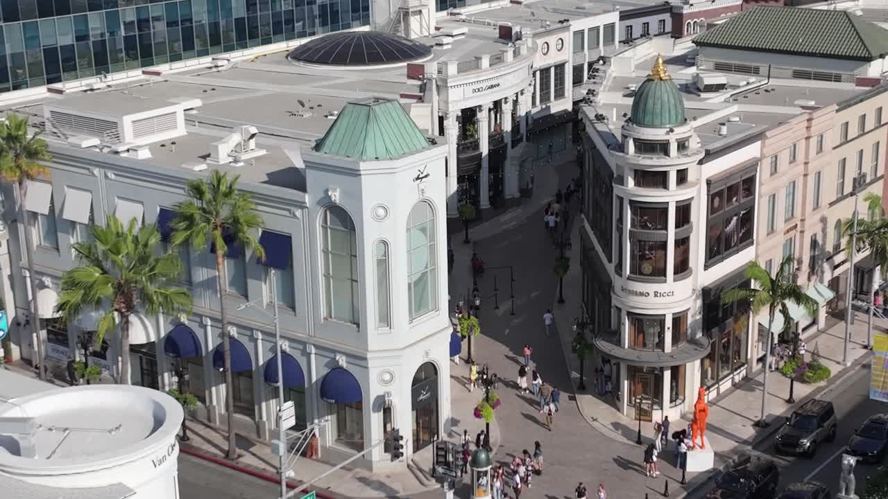 Two Rodeo, luxury shopping destination at intersection of Rodeo Drive and Wilshire in Beverly Hills, aerial rising view