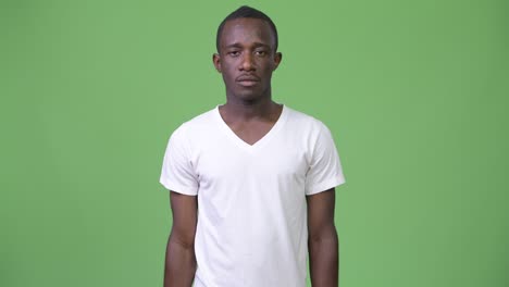 young african man pointing at camera