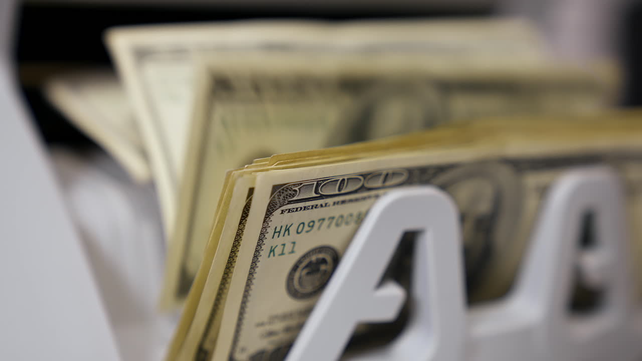 Counting dollar banknotes. Money counting equipment for paper money calculation