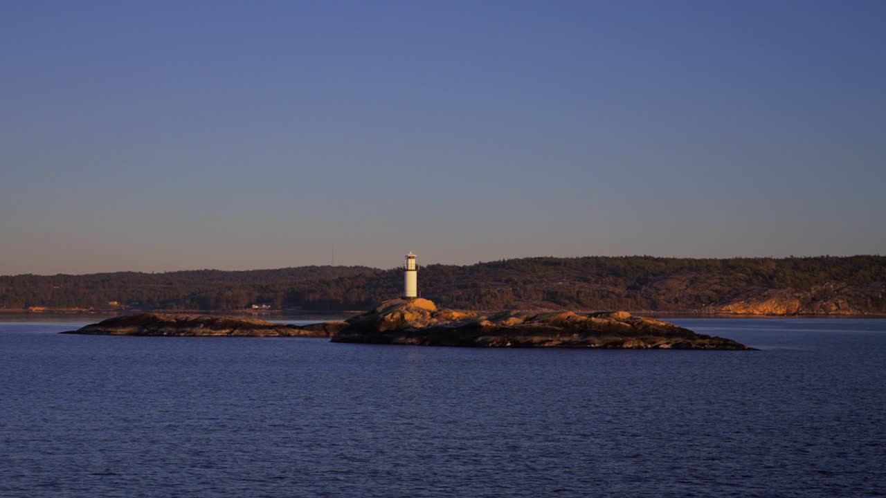 Ursholmen Lighthouse Ytre Hvaler National Park Strömstad Stromstad Oslo Fjord Sweden Sverige Norway Norge golden hour Arctic sunlight sunset ferry boat ride Scandinavia islands parallax right motion