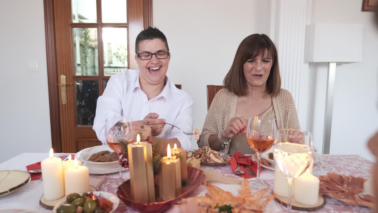 Lesbian couple and family enjoying the Christmas lunch
