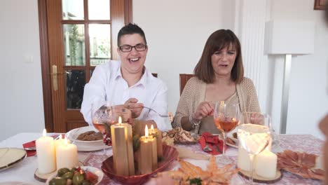 lesbian couple and family enjoying the christmas lunch