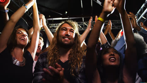 group of people dancing at a concert 4k