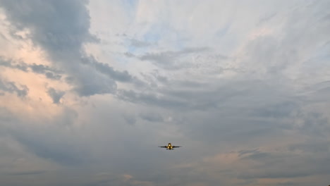 airplane approaching for landing during sunset