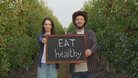 farmers promote healthy eating in an apple orchard