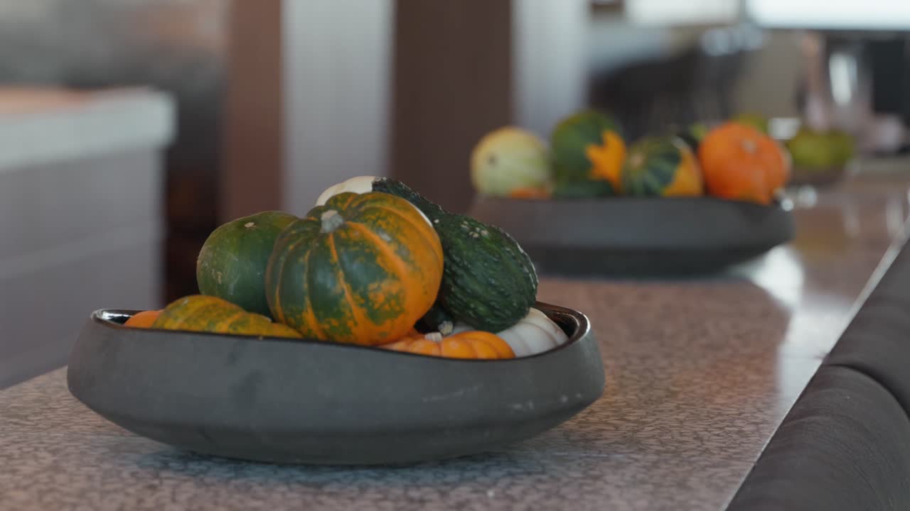 Close up, Bowls of mini squash pumpkins used for decorations in a restaurant for celebrating fall and Halloween