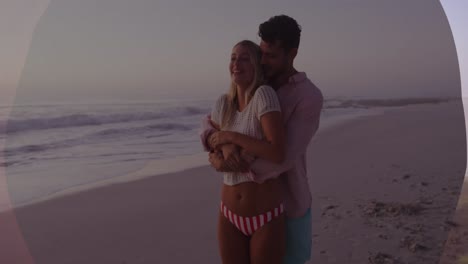 Animation-of-banner-with-copy-space-over-caucasian-couple-embracing-each-other-at-the-beach